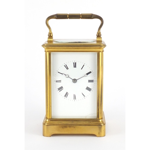 2164 - Large gilt brass cased carriage clock striking on a gong, with enamelled dial having Roman numerals ... 