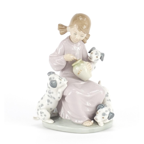 2168 - Lladro figurine of a girl with puppies, 20cm high