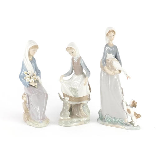 2267 - Three Lladro figurines including a girl with a goose and puppy, the largest 27cm high