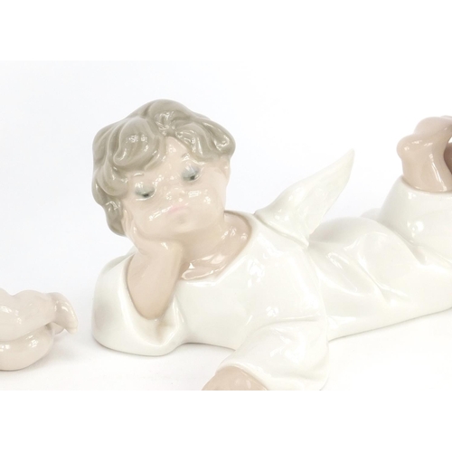 2337 - Lladro and Nao china including young boy with a teddy bear and cherubs, the largest 19.5cm high
