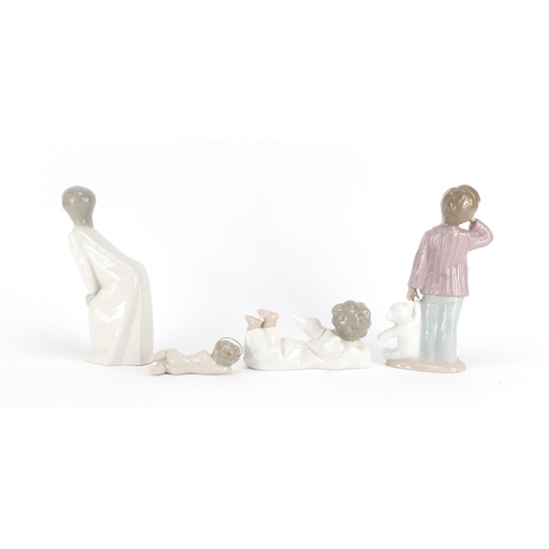 2337 - Lladro and Nao china including young boy with a teddy bear and cherubs, the largest 19.5cm high
