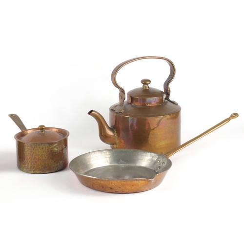 131 - Graduated set of three copper and brass saucepans, a pan and a kettle