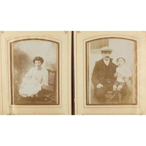 505 - Victorian and later black and white photographs, arranged in an album and four fold leather frame