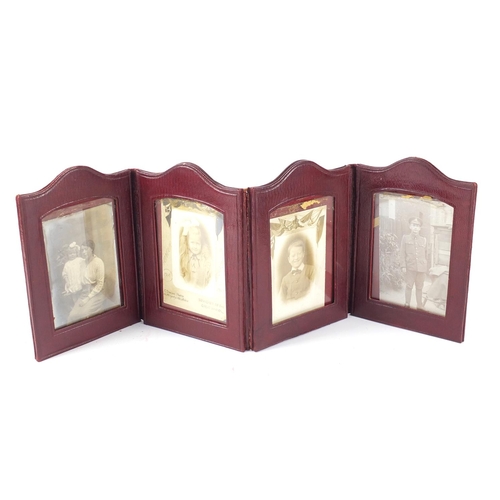 505 - Victorian and later black and white photographs, arranged in an album and four fold leather frame