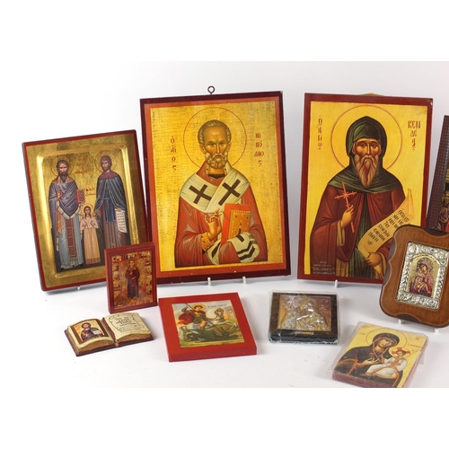187 - Collection of Russian Orthodox icons and wall hangings, the largest, 30cm high