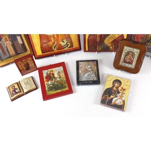 187 - Collection of Russian Orthodox icons and wall hangings, the largest, 30cm high