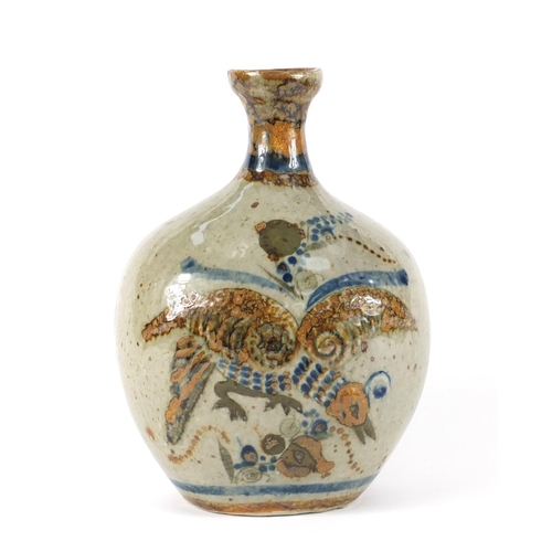 79 - Mexican Tonala pottery vase, decorated with a lion and a vulture, 23cm high