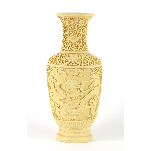 280 - Chinese ivorine vase decorated with dragons amongst clouds, 26cm high