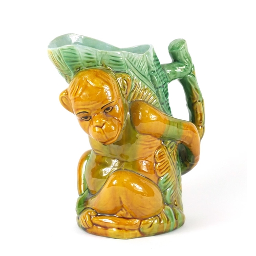 118 - Majolica pottery monkey jug, 18cm high