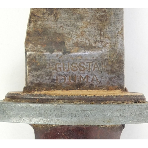 297 - German World War II combat knife with sheath, the steel blade impress Gusstah Puma, 26.5cm in length