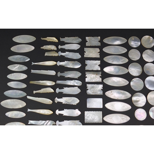 493 - Collection of Chinese Canton mother of pearl gaming counters, some engraved with pagodas, the larges... 