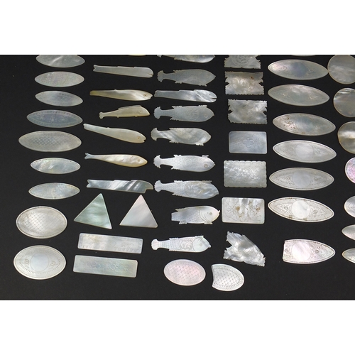 493 - Collection of Chinese Canton mother of pearl gaming counters, some engraved with pagodas, the larges... 