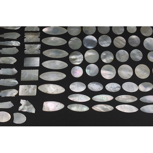 493 - Collection of Chinese Canton mother of pearl gaming counters, some engraved with pagodas, the larges... 