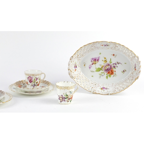 640 - German porcelain hand painted with flowers by Dresden, comprising a basket shaped fruit bowl, three ... 