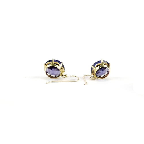 869 - Pair of unmarked gold Alexandrite solitaire earrings, 1.2cm in diameter, 6.8g
