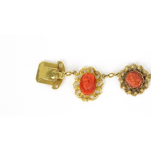 851 - 18th/19th century unmarked gold coral necklace (tests as 9ct), with 15 coral panels each carved with... 