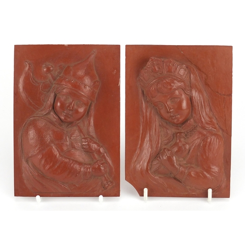54 - Pair of continental rectangular red clay plaques, finely decorated in relief with a young boy and gi... 