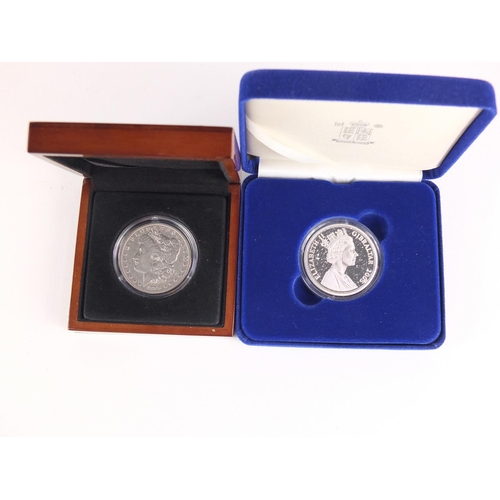 2644 - Battle of Trafalgar silver proof commemorative crown and a 1899 US Morgan silver dollar, both with c... 