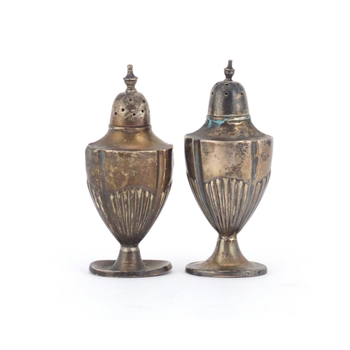 2590 - Two Edwardian silver demi fluted casters by Walker & Hall, Sheffield 1904, 9cm high, 69.0g