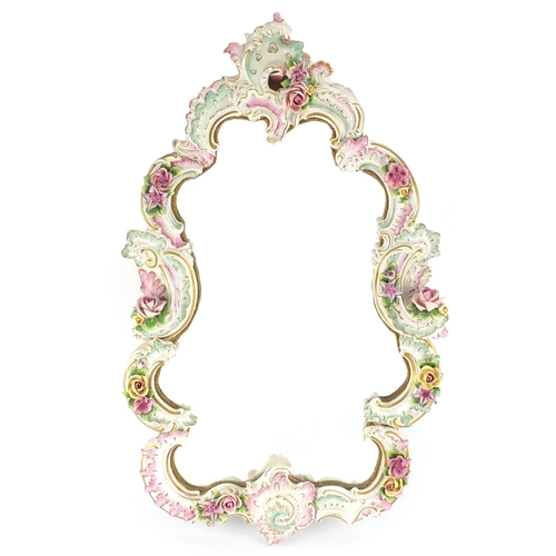 2068 - Continental floral encrusted porcelain cartouche mirror, hand painted and gilded with C scrolls, 63c... 
