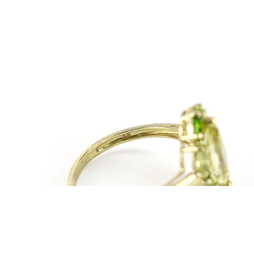 2716 - 9ct gold peridot and green stone ring, size T, 3.3g