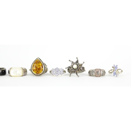 2963 - Ten silver rings, some set with semi precious stones and enamel, various sizes, 70.8g