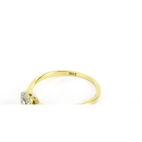 2664 - 18ct gold diamond flower head ring, size Q, 2.1g