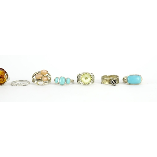 2919 - Ten silver rings set with semi precious stones, various sizes, 63.0g