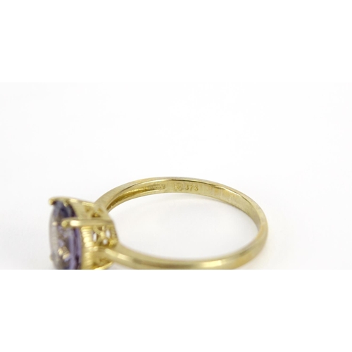 2934 - 9ct gold purple stone solitaire ring, size T, 2.8g