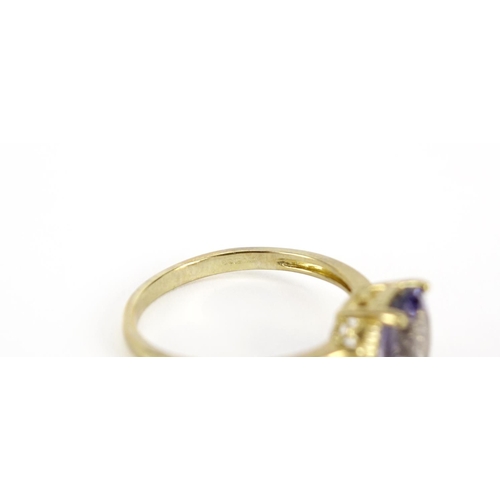 2934 - 9ct gold purple stone solitaire ring, size T, 2.8g