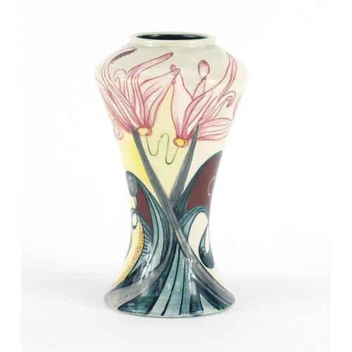 2199 - Black Ryden vase hand painted with stylised flowers, impressed marks and painted initials to the bas... 