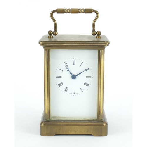 2198 - Brass cased carriage clock with enamelled dial and Roman numerals, 11cm high