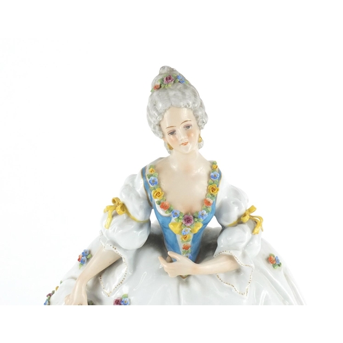 2401 - Austrian porcelain figurine of a female wearing a dress, hand painted with flowers, factory marks an... 
