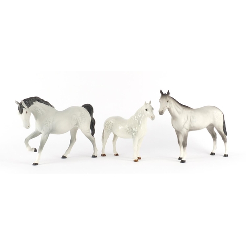 2483 - Two Beswick matt grey horses and a Connemara dapple grey example, the largest 20cm high
