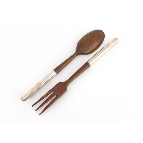 2596 - Pair of wooden salad servers with sterling silver handles, by Asprey & Co, 27cm long
