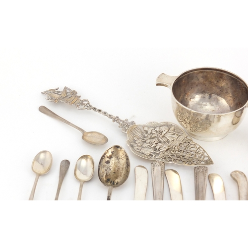 2583 - Silver items including a twin handled quaich, teaspoons, sugar tongs and silver handled butter knive... 