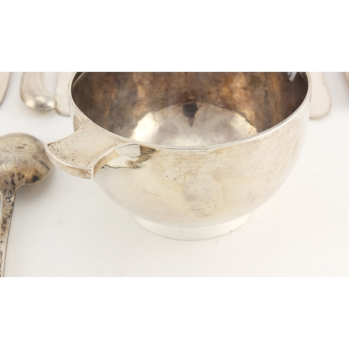 2583 - Silver items including a twin handled quaich, teaspoons, sugar tongs and silver handled butter knive... 