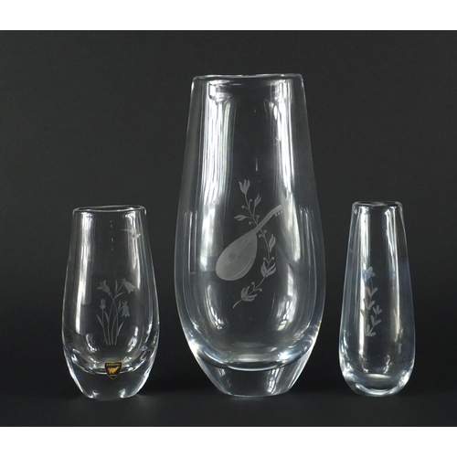 2381 - Three Orrefors glass vases including a large example etched with a mandolin, one with paper label, t... 