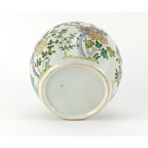 2379 - Chinese porcelain jar and cover, hand painted in the famille rose palette with flowers, 22.5cm high