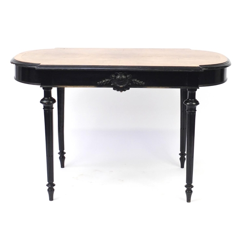 2059 - Quarter veneered and ebonised centre table raised on fluted legs, fitted with a drawer to one side, ... 