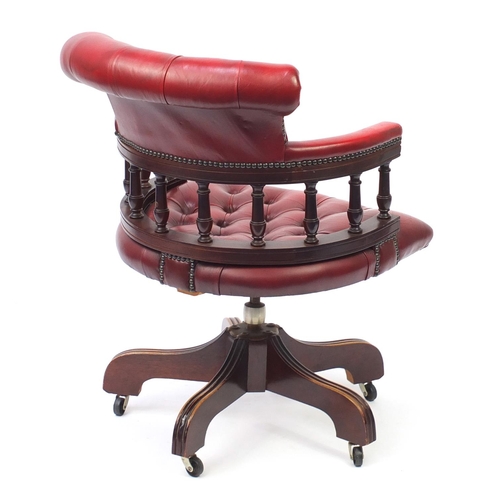 2071 - Mahogany framed oxblood leather button back captains chair, 88cm high