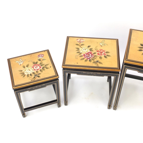 2025 - Chinese lacquered quarteto nest of tables, each decorated with birds and flowers, the largest 66cm H... 