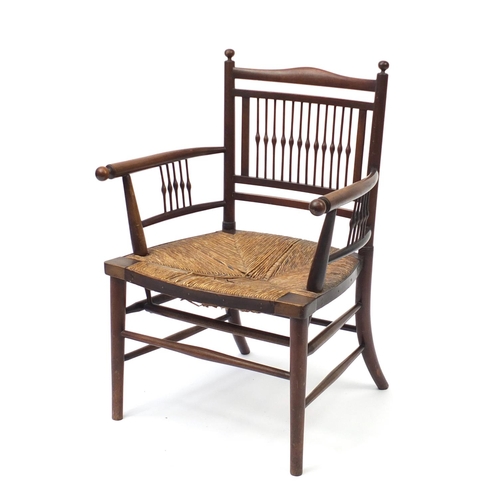 2043 - William Morris style Sussex chair with spindle back and rush seat, 77cm high