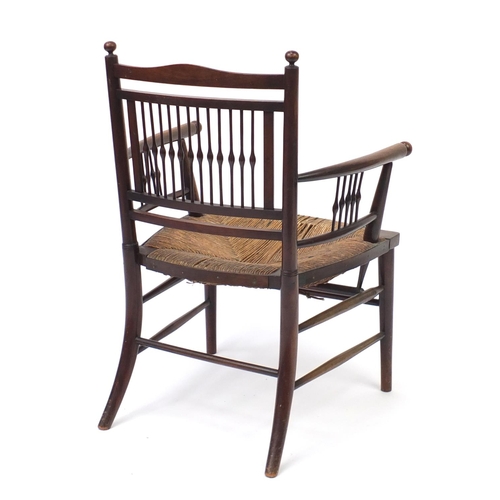 2043 - William Morris style Sussex chair with spindle back and rush seat, 77cm high