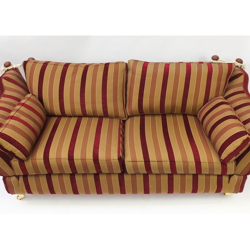 2017 - Knoll drop end three seater settee with red and gold upholstery, 230cm in Length