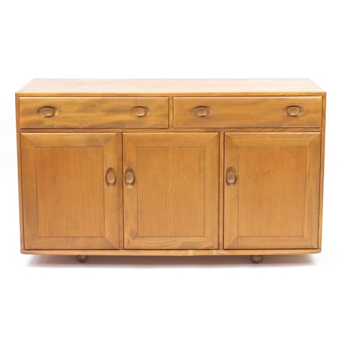 2009 - Ercol Windsor light elm sideboard with two drawers above three cupboard doors, 81cm H x 136cm W x 46... 