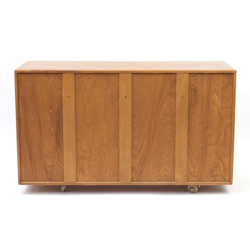 2009 - Ercol Windsor light elm sideboard with two drawers above three cupboard doors, 81cm H x 136cm W x 46... 
