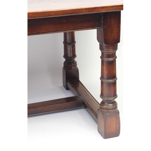 2019 - Oak refectory table with cannon barrel legs united by a H stretcher, 76cm H x 223cm W x 98cm W