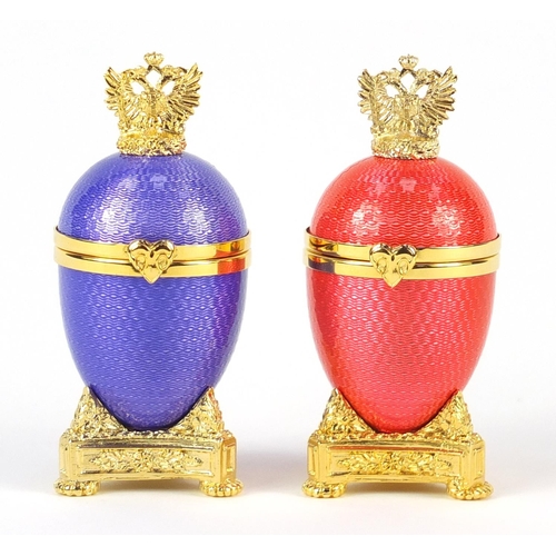 2400 - Two Faberge style guilloche enamel egg trinkets on gilt metal stands, each 9cm high