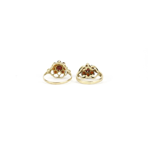 2683 - Two 9ct gold garnet flower head rings, size O and H, 4.7g
